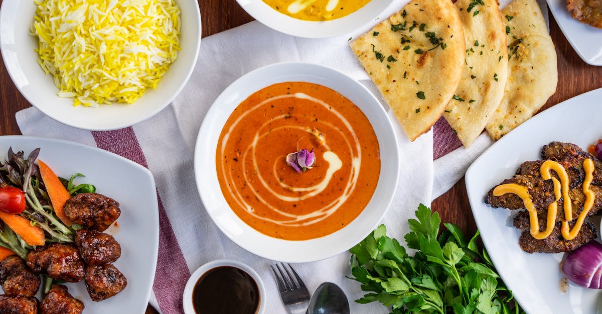 An array of authentic Indian dishes featuring curries, naan, and biryani, showcasing vibrant flavors and spices.